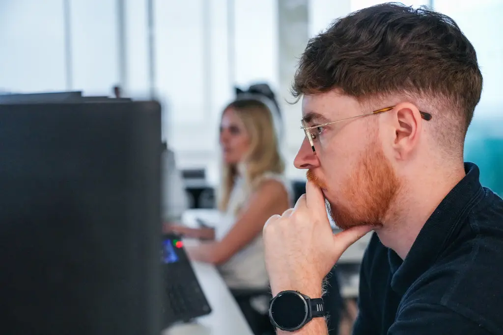 Layer8 team member at desk